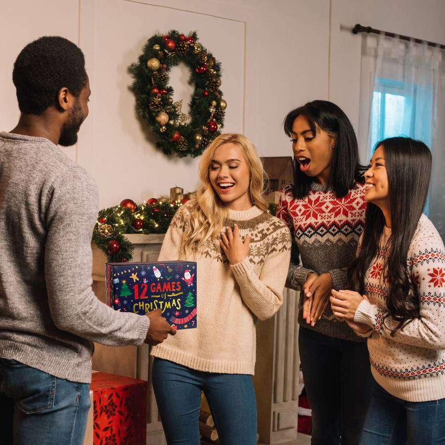 Friends unwrapping the 12 Games of Christmas gift